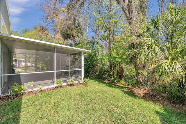 view of yard featuring a sunroom