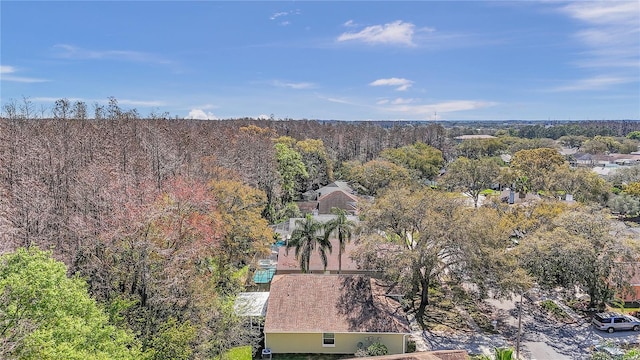 birds eye view of property with a forest view