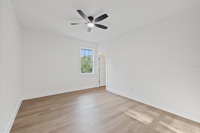 3902 E Henry Ave, Tampa, FL 33610 - spare room with ceiling fan, baseboards, and wood finished floors