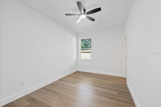 3902 E Henry Ave, Tampa, FL 33610 - unfurnished room featuring light wood-type flooring, baseboards, and ceiling fan