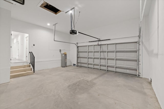 3902 E Henry Ave, Tampa, FL 33610 - garage featuring a garage door opener and electric water heater
