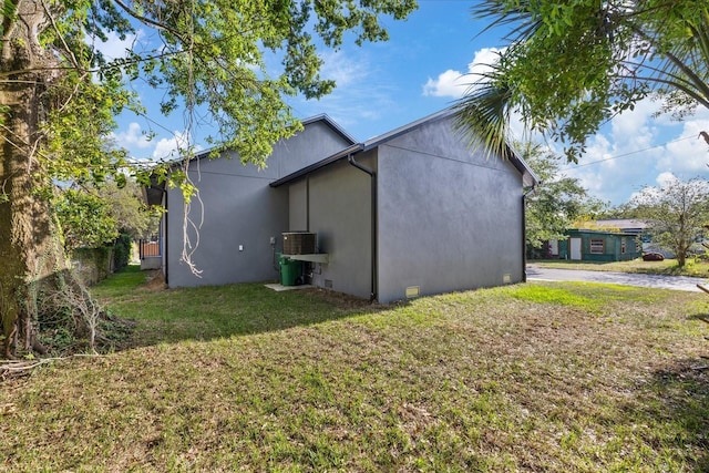 3902 E Henry Ave, Tampa, FL 33610 - exterior space with a yard and stucco siding