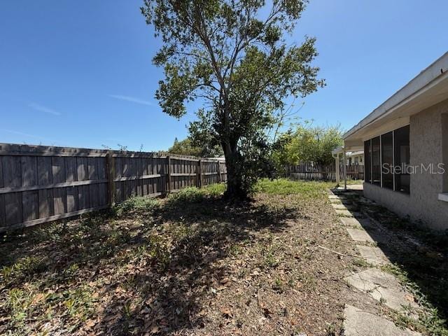 view of yard featuring a fenced backyard