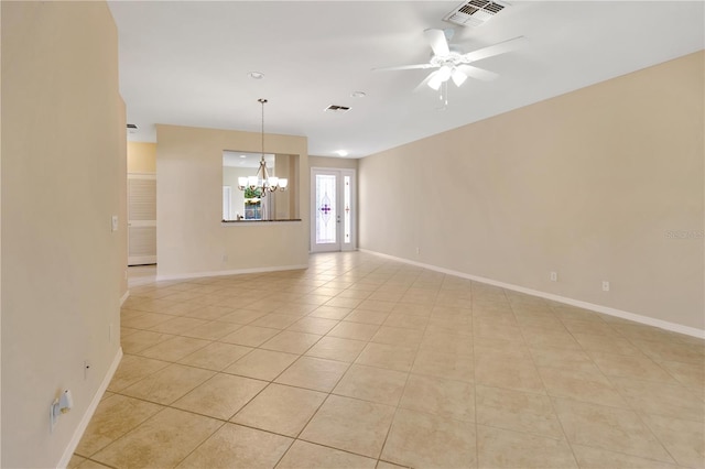 unfurnished room with light tile patterned flooring, visible vents, baseboards, and ceiling fan with notable chandelier