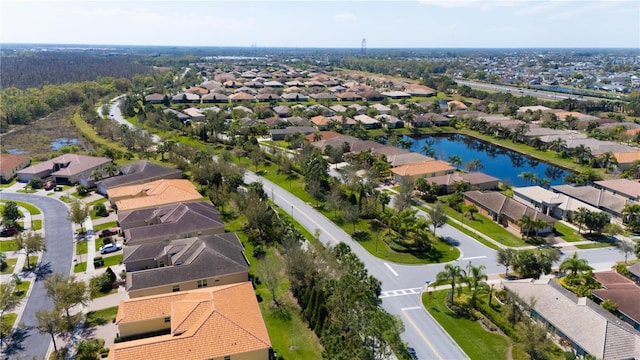 birds eye view of property featuring a residential view and a water view