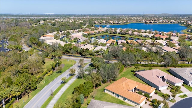 birds eye view of property featuring a water view and a residential view