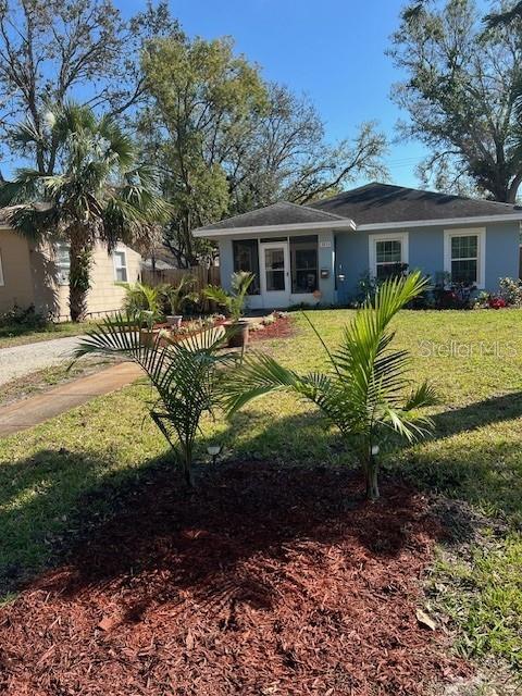 view of front of home featuring a front lawn and stucco siding