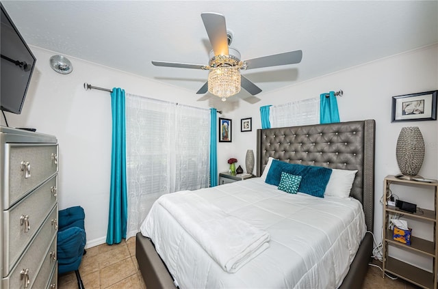 tiled bedroom with a ceiling fan