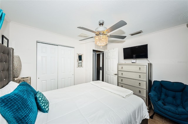 bedroom with visible vents, a closet, and ceiling fan