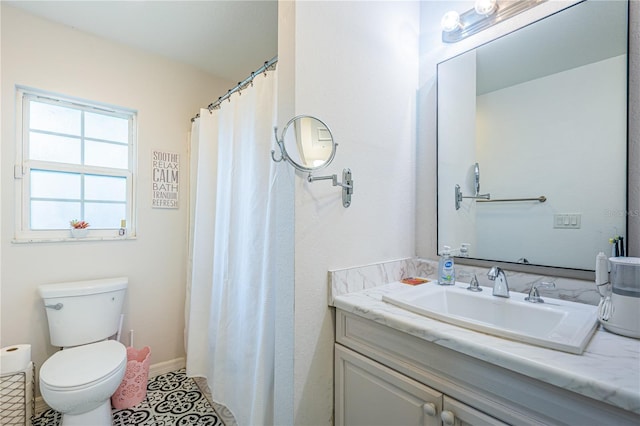 bathroom with tile patterned floors, toilet, a shower with shower curtain, baseboards, and vanity