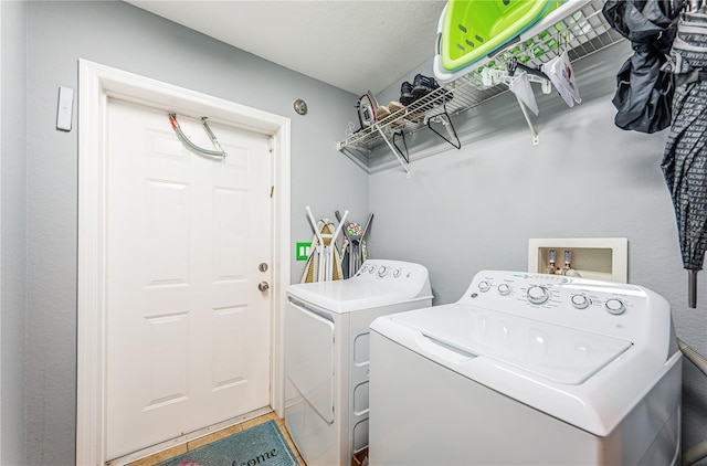 washroom featuring laundry area and independent washer and dryer