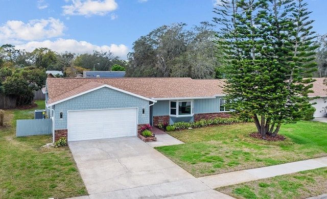 ranch-style home with driveway, an attached garage, fence, a front yard, and brick siding