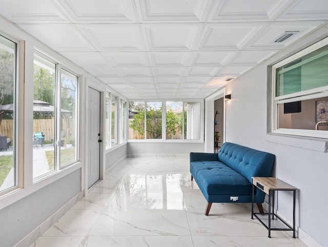 sunroom / solarium featuring a healthy amount of sunlight and visible vents