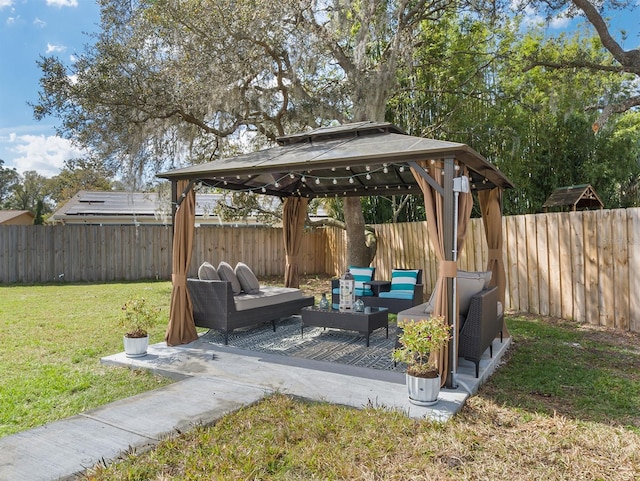 view of patio / terrace featuring a gazebo, outdoor lounge area, and a fenced backyard