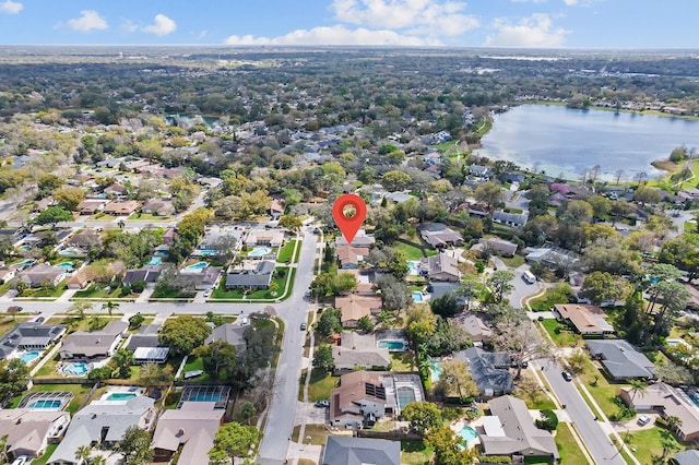 drone / aerial view featuring a water view and a residential view