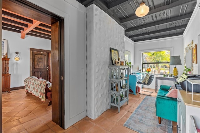 interior space with wooden ceiling, beamed ceiling, baseboards, and tile patterned floors