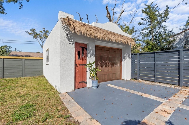 garage with fence