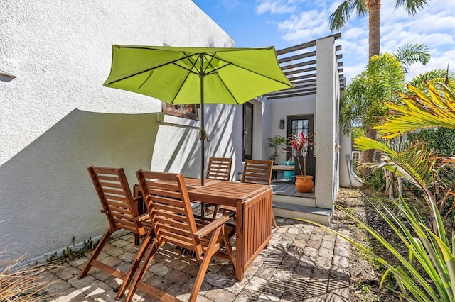 view of patio / terrace featuring outdoor dining space and a pergola