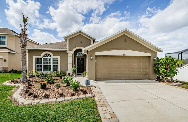 ranch-style home with concrete driveway, a shingled roof, an attached garage, and stucco siding