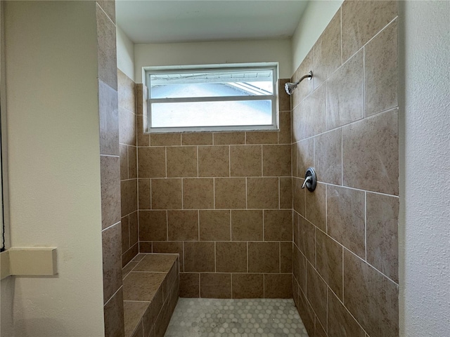 full bathroom with a tile shower