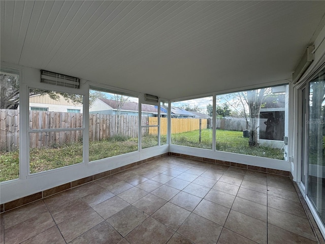 unfurnished sunroom featuring a healthy amount of sunlight