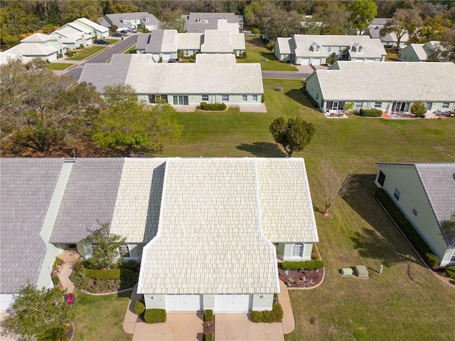 birds eye view of property with a residential view