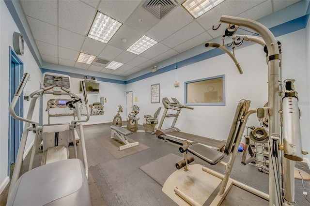 workout area featuring visible vents and a drop ceiling