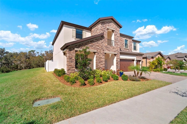 view of front of house featuring driveway, a garage, stone siding, a front yard, and stucco siding