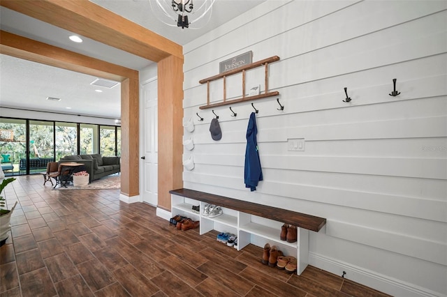 mudroom with wood tiled floor, visible vents, baseboards, and recessed lighting