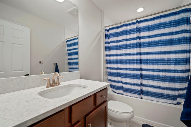 full bathroom with shower / tub combo with curtain, vanity, and toilet