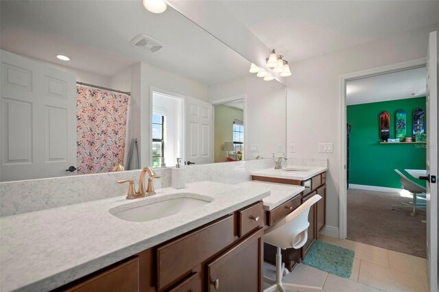 full bathroom featuring tile patterned flooring, visible vents, baseboards, and vanity