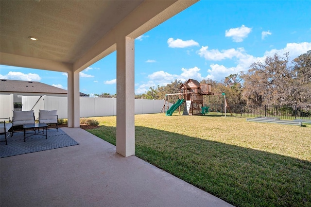 view of patio / terrace featuring a playground and a fenced backyard