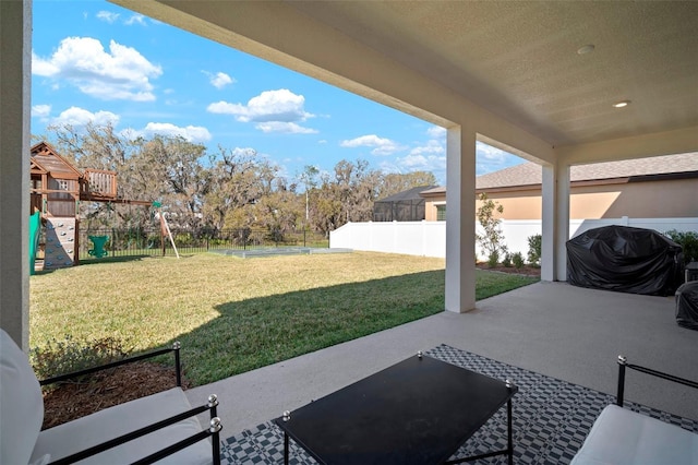 view of patio / terrace with a playground, a fenced backyard, and a grill