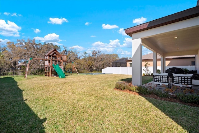 view of yard with a playground and fence