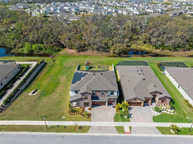 bird's eye view featuring a residential view and a water view