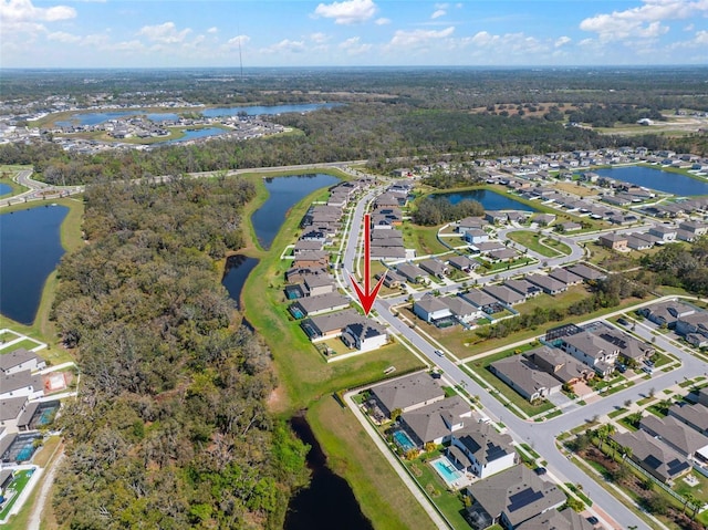 bird's eye view featuring a water view and a residential view