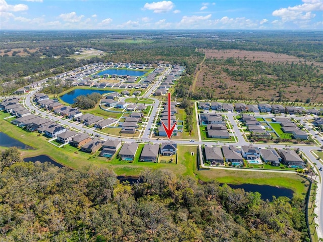 birds eye view of property with a water view and a residential view