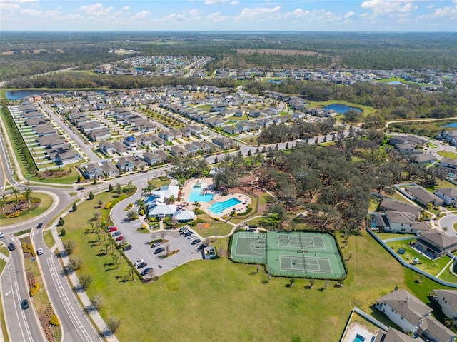 birds eye view of property with a water view and a residential view