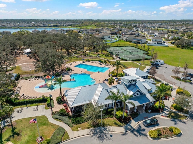 drone / aerial view with a water view and a residential view