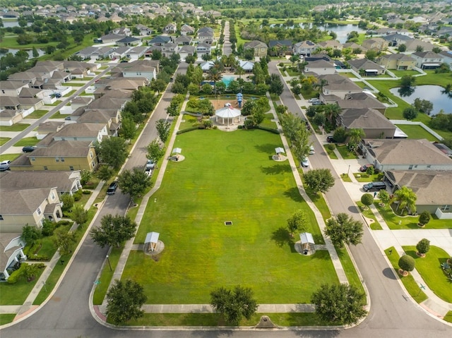 birds eye view of property featuring a water view and a residential view