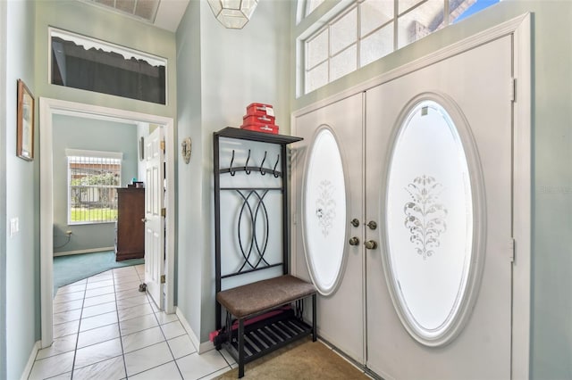 entryway with french doors, visible vents, and baseboards