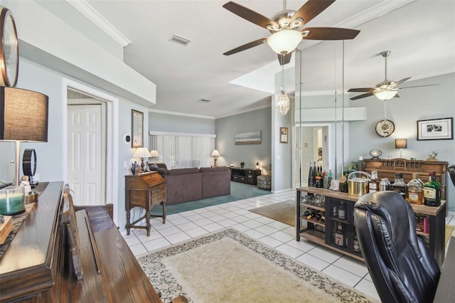 tiled office space with a ceiling fan, visible vents, and crown molding