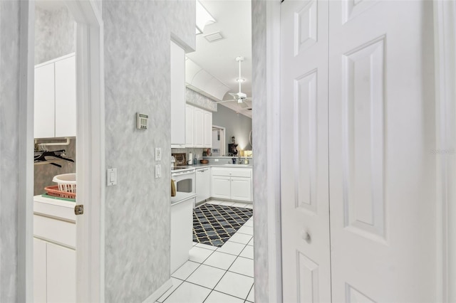 bathroom with a ceiling fan, tile patterned flooring, visible vents, and vanity