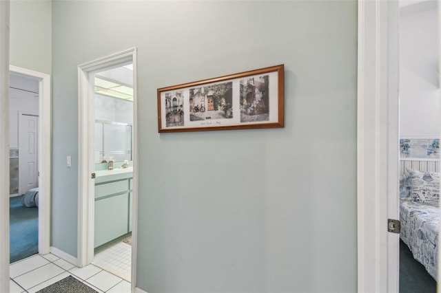 hallway with light tile patterned floors