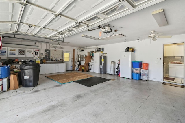 garage featuring electric water heater, a ceiling fan, freestanding refrigerator, and a garage door opener