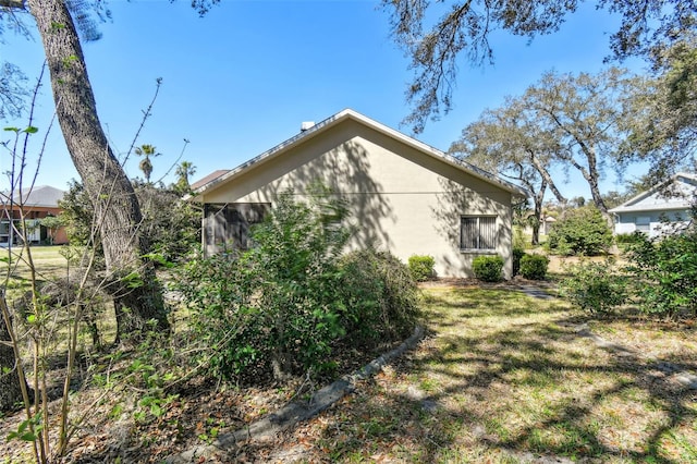 view of property exterior featuring a yard