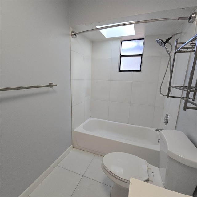 bathroom featuring baseboards, shower / bath combination, toilet, and tile patterned floors