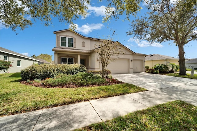 view of front facade with a front lawn, concrete driveway, an attached garage, and stucco siding