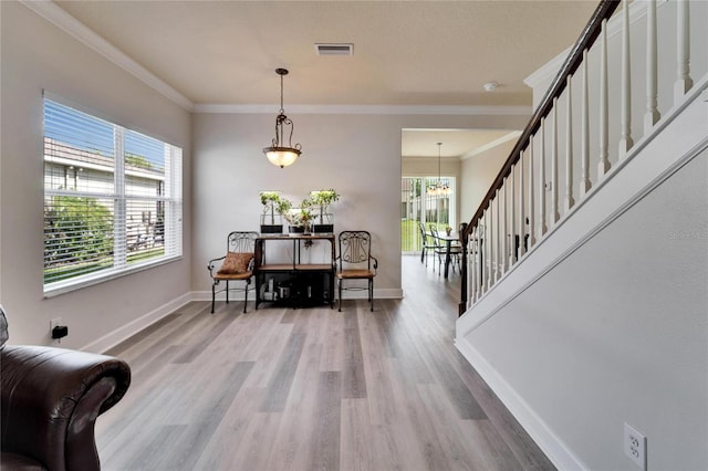 dining area with ornamental molding, stairway, wood finished floors, and baseboards