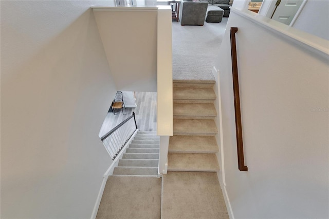 staircase with carpet flooring and baseboards